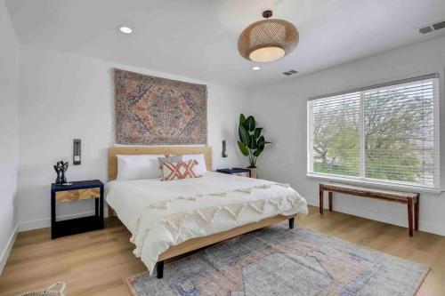 a bedroom with a bed and a large window at Casa Malca Tulum in Indio