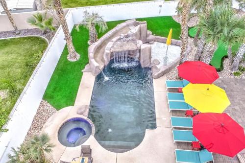 an overhead view of a swimming pool with umbrellas at Happy Hour in Bermuda Dunes