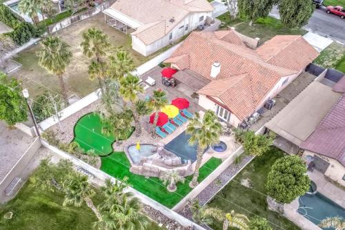 an overhead view of a house with a pool and umbrella at Happy Hour in Bermuda Dunes