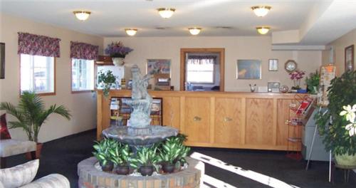 a living room with a fountain in the middle of a room at Model A Inn in Cranbrook