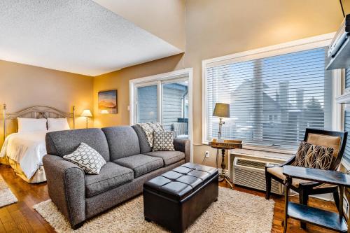 a living room with a couch and a bed at Condo 614 at North Creek Resort in Blue Mountains