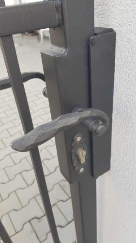 a black metal object with a screw in a wall at Chaloupka Na Pivovaře Seč in Seč