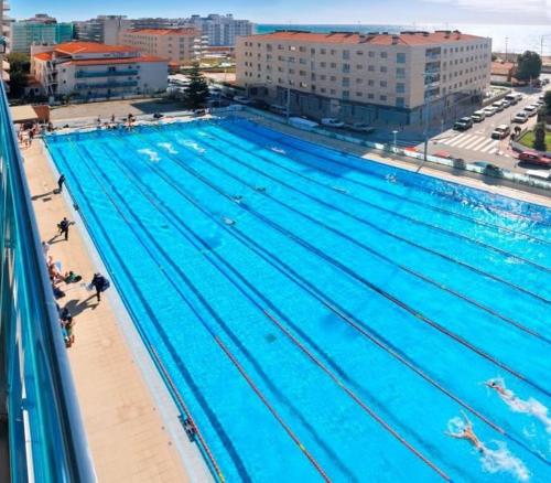 an overhead view of a large swimming pool at Calella Can Saula III in Calella