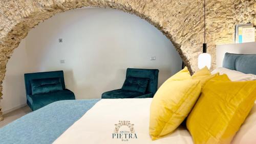 Postel nebo postele na pokoji v ubytování Arco di Pietra B&B