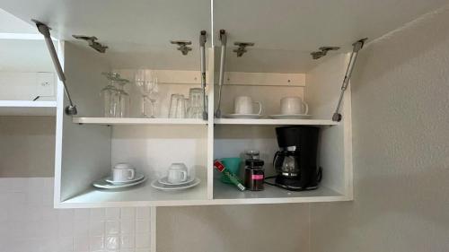 Dapur atau dapur kecil di Aquarius Flat Aptos e Suítes