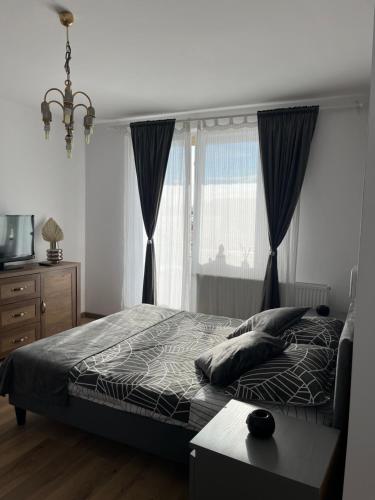 Ένα ή περισσότερα κρεβάτια σε δωμάτιο στο Apartament acasă