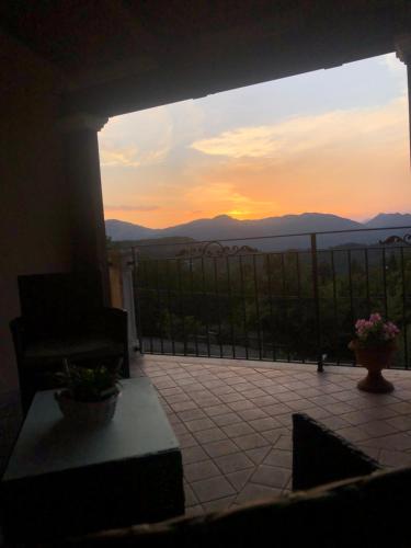 a view of a sunset from the balcony of a house at B&B La Terrazza in Mormanno