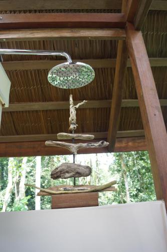 a chandelier hanging from the ceiling of a porch at Mar Verde Lodge in Puerto Viejo
