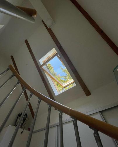 a window in the ceiling of a stair case at Vila Dolina Izvora in Sarajevo