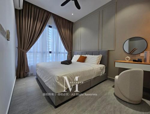 a bedroom with a bed and a chair and a mirror at Setia Alam Walking Distance Convention Centre Executive Suite 2Pax in Setia Alam