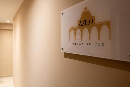 a sign on the wall of a uandan suite at Azilo Urban Suites in Kos Town