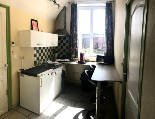Kuchyň nebo kuchyňský kout v ubytování Studio autonome terrasse privée