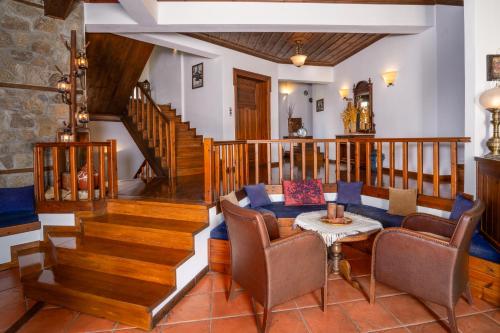 a living room with a couch and a table at Hotel Ligeri in Elati Trikalon