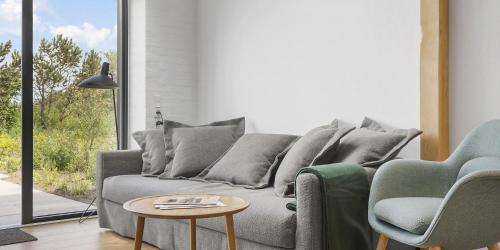 Area soggiorno di Møllegården Apartment Hotel with Yoga, Panorama-Sauna & Coworking Space