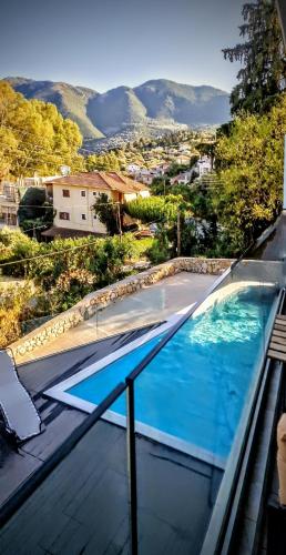 a large swimming pool on top of a house at EXOTIC LUXURY APARTMENT in Nikiana