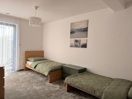 Ένα ή περισσότερα κρεβάτια σε δωμάτιο στο Indigo Home