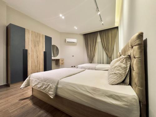 Ένα ή περισσότερα κρεβάτια σε δωμάτιο στο Luxury apart in Al Mohandiseen