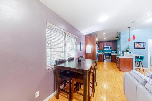 a kitchen and living room with a table and a couch at Old River Hideaway in Guerneville