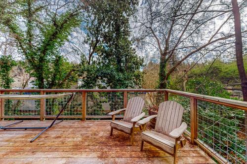 two chairs sitting on the deck of a house at Old River Hideaway in Guerneville