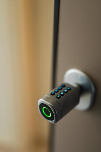 a remote control sticking out of a door at Oktolia suites in Alexandroupoli