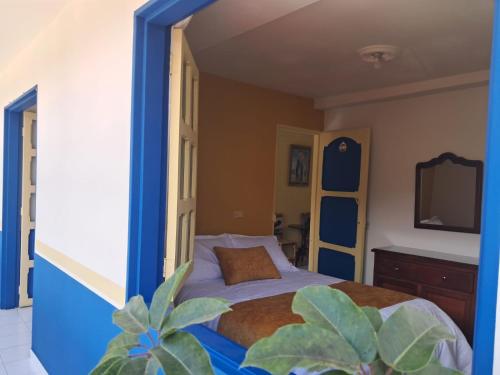 Postel nebo postele na pokoji v ubytování Hotel Dorado Jardín