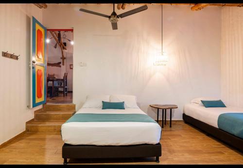 Ein Bett oder Betten in einem Zimmer der Unterkunft Casa Saman by tesorito fincas exclusivas