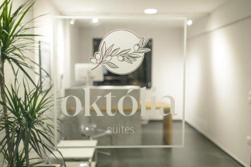 a logo on a glass door of a salon at Oktolia suites in Alexandroupoli