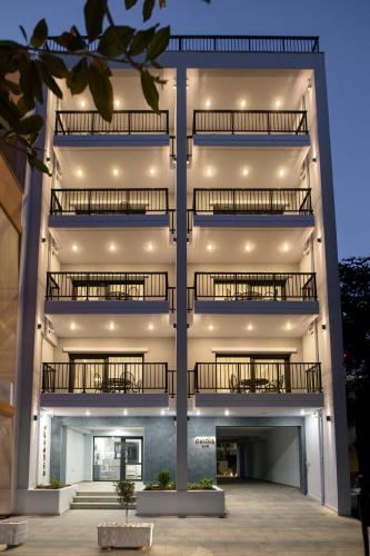 a building with balconies on the side of it at Oktolia suites in Alexandroupoli