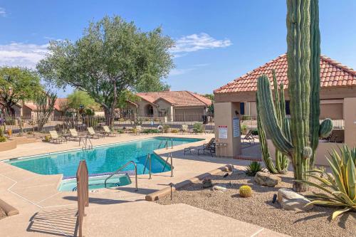 a swimming pool at a resort with a cactus at Serenity Ridge in Scottsdale