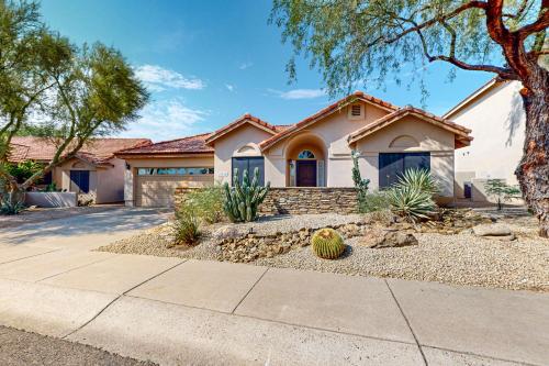 a home in a subdivision with a house at Serenity Ridge in Scottsdale