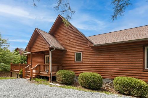 a log home with a porch and a deck at Mountain Heir in Fleetwood