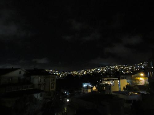 a view of a city at night with lights at Valparadise Hostel in Valparaíso