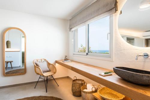 a bathroom with a large sink and a window at Villa Atalis in Son Bou