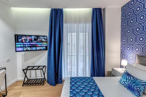 Ένα ή περισσότερα κρεβάτια σε δωμάτιο στο Nibla's Room Napoli