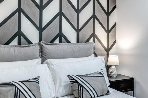 Ένα ή περισσότερα κρεβάτια σε δωμάτιο στο Nibla's Room Napoli