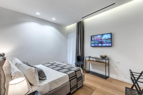 Ένα ή περισσότερα κρεβάτια σε δωμάτιο στο Nibla's Room Napoli