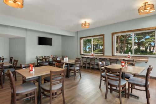 a dining room with wooden tables and chairs at Best Western Inn at Face Rock in Bandon