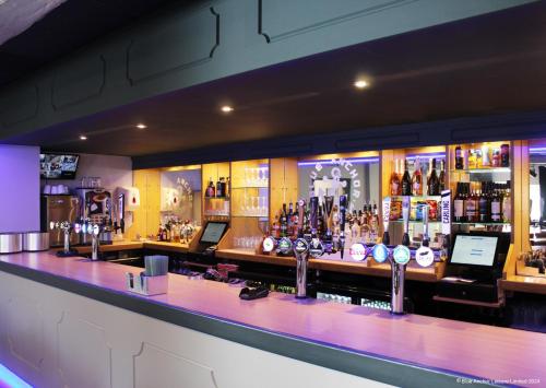 a bar with a lot of bottles of alcohol at Towervans Holiday Park in Mablethorpe