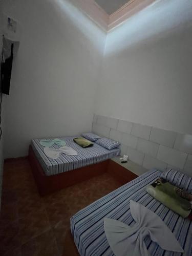 Postel nebo postele na pokoji v ubytování Pousada Gaivota Do Araguaia