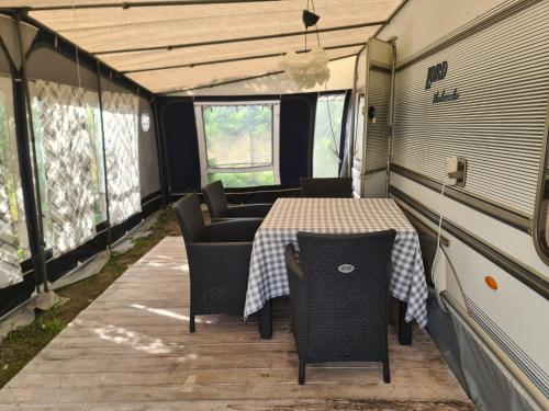 an inside view of an rv with a table and chairs at Camping - Park Władysławowo in Władysławowo