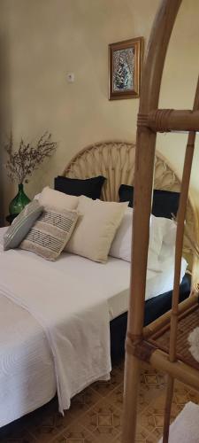 Ένα ή περισσότερα κρεβάτια σε δωμάτιο στο Il Nido Karino