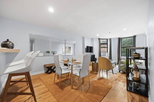 a kitchen and dining room with a table and chairs at The Lenox in New York