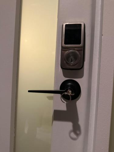 a door with a cell phone sticking out of it at Exclusive B and B room in Lyndhurst