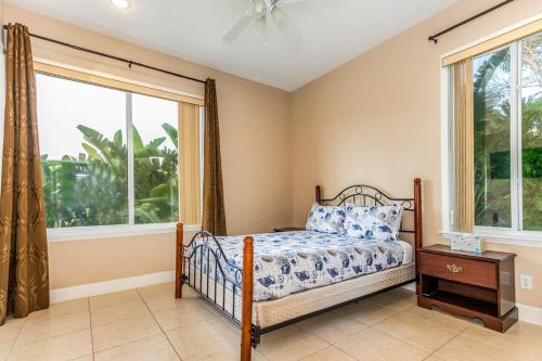 a bedroom with a bed and a window at Sweet Escape - Monthly Beach Rental in Clearwater Beach