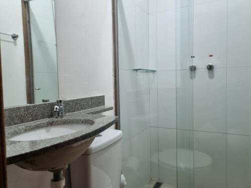 a bathroom with a sink and a shower at Star Hotel in Juiz de Fora