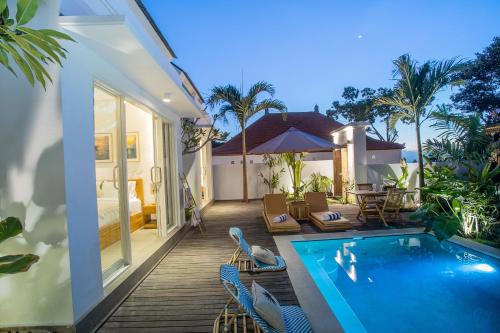 a villa with a swimming pool and a patio at Alas Villa - 3 Bedrooms Private Pool Villa in Nusa Lembongan
