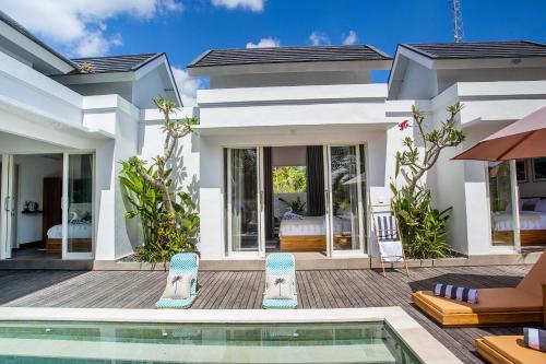 a villa with a swimming pool and a house at Alas Villa - 3 Bedrooms Private Pool Villa in Nusa Lembongan