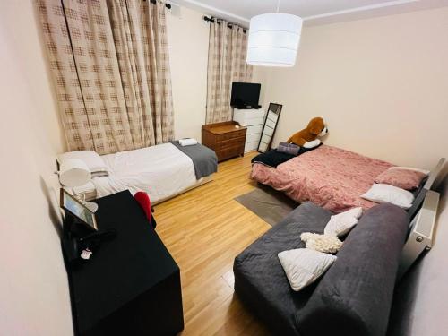 Postel nebo postele na pokoji v ubytování Dormitorio Grande D08