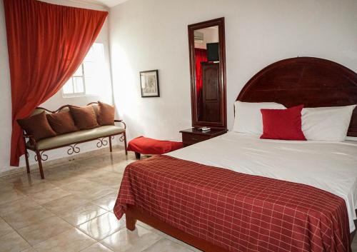 Postel nebo postele na pokoji v ubytování Hotel Nuevo Amanecer