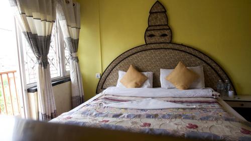 Postel nebo postele na pokoji v ubytování Nirvana Green Peace Home
